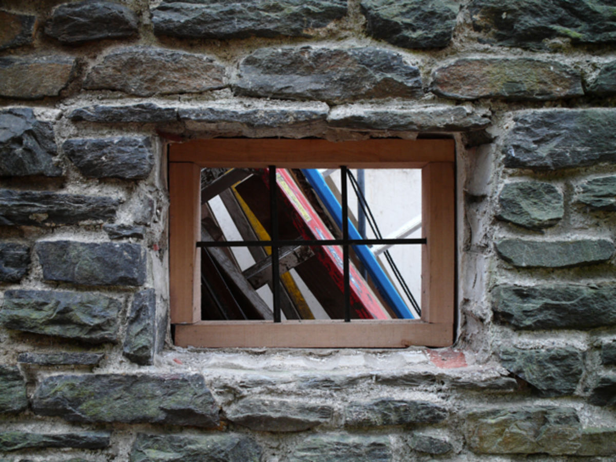 window in stone house being renovated