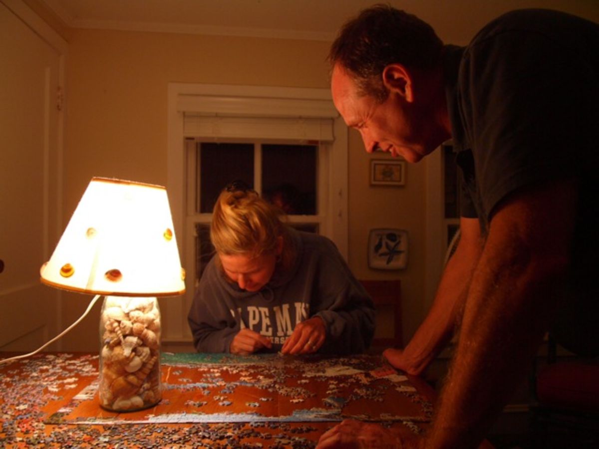 Mary Garrett and Bob working on puzzle