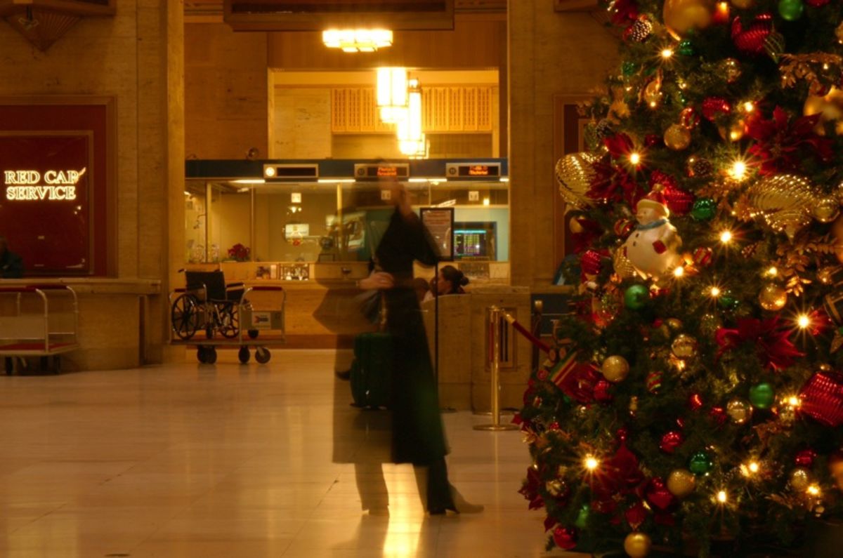 woman by Christmas tree